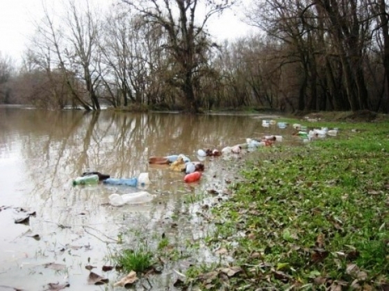 Floating Waste Flowing Down On River Tisza In Hungary